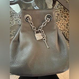 Michael Kors mini bucket crossbody bag. Grey pebble leather w/silver hardware.